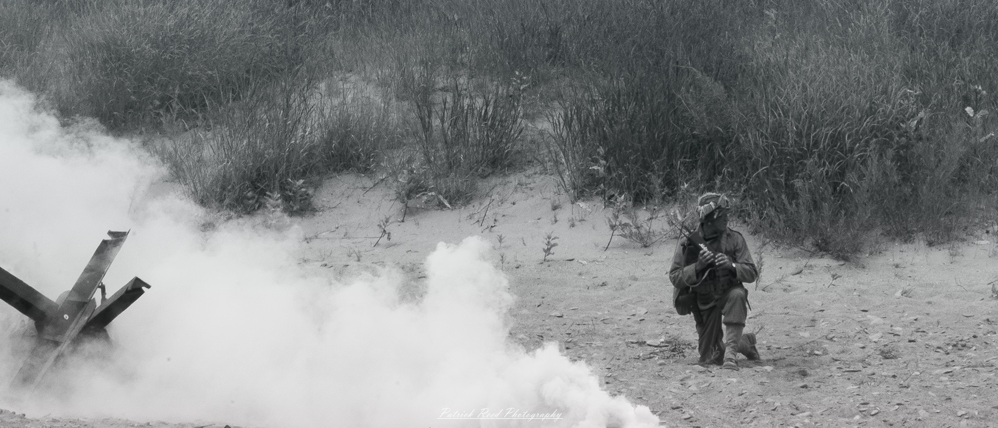 A soldier on the battlefield, holding a radio close to his ear while surrounded by swirling smoke. His expression is tense and focused, reflecting the urgency of communication in the midst of chaos, as he relays critical information to his comrades.